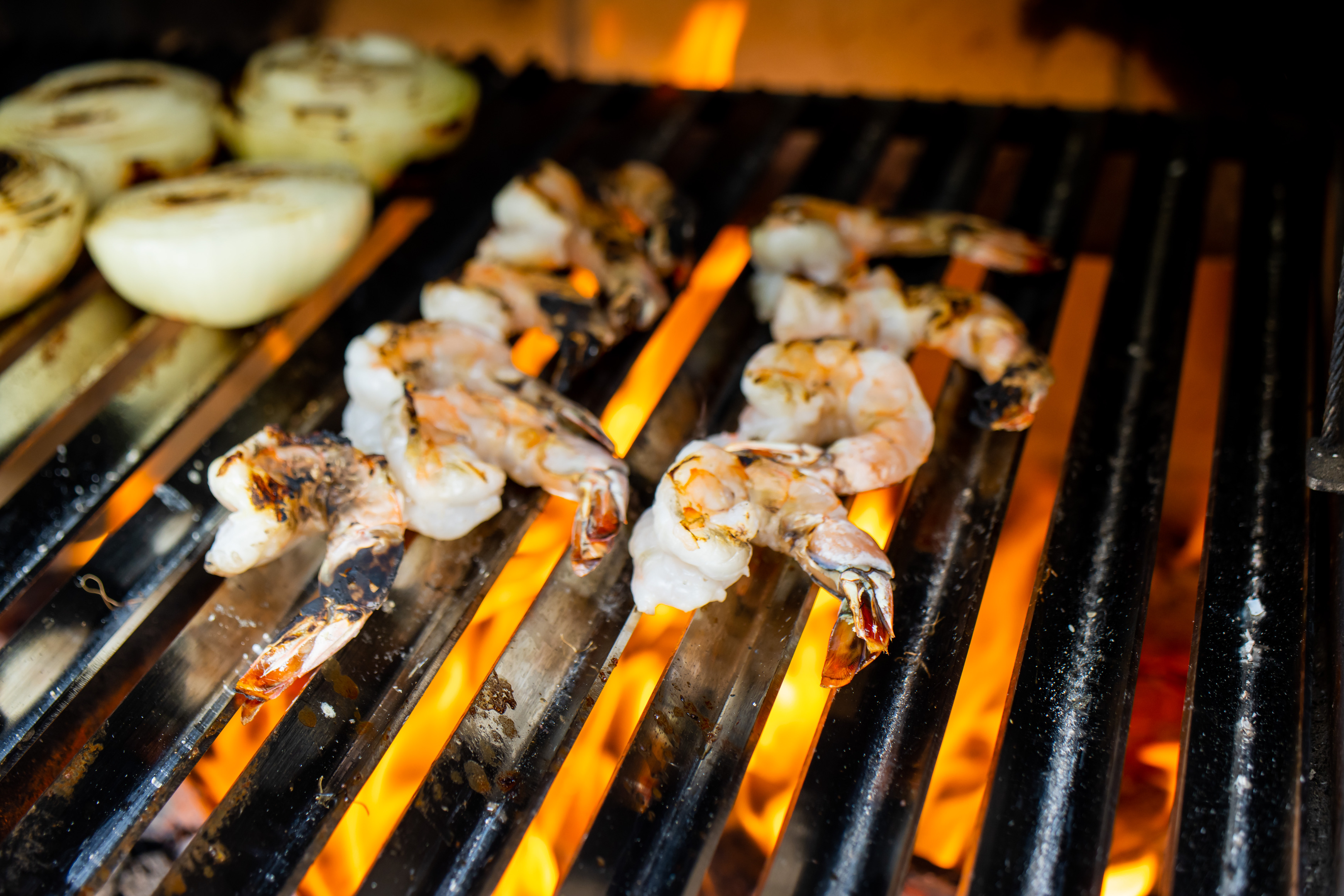 several hot dogs on a grill