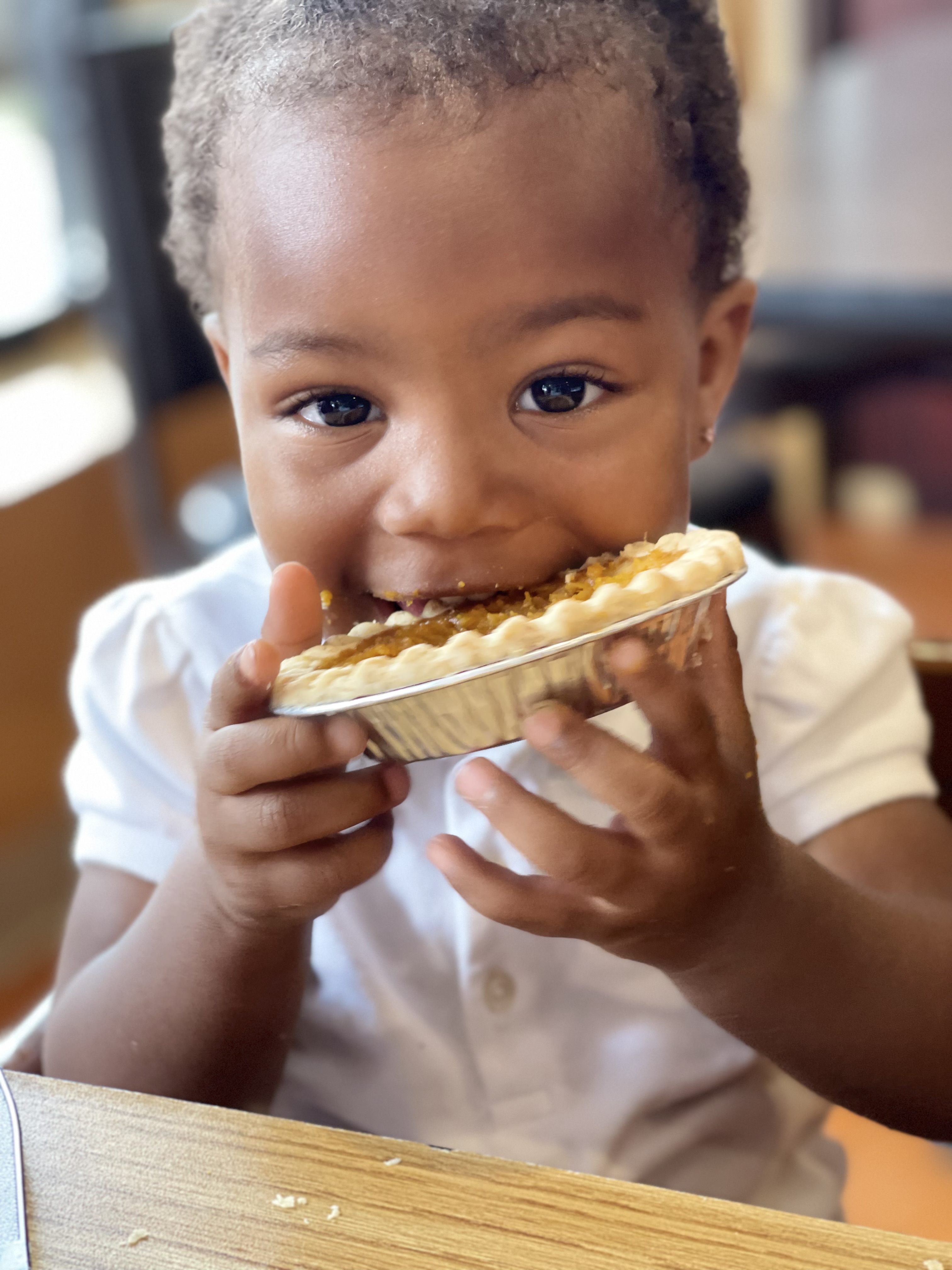 a little boy that is eating some food