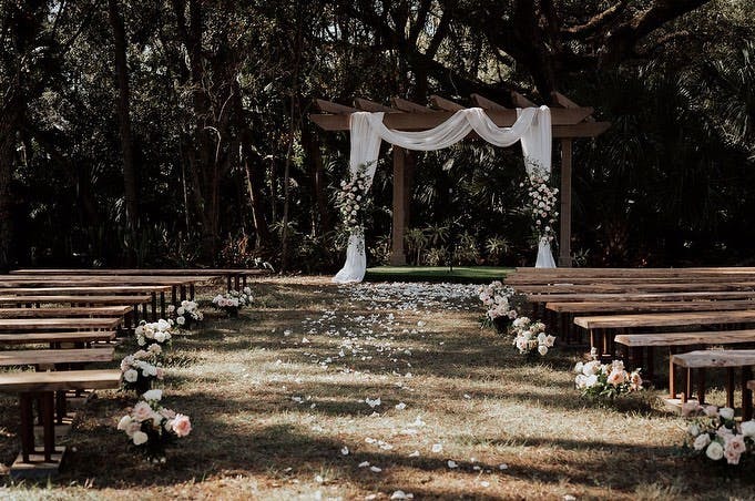 a wooden bench sitting in the middle of a park