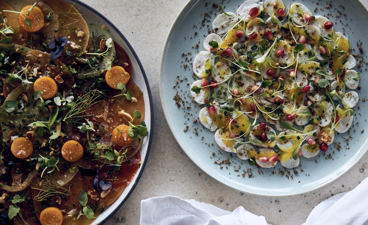 two plates of Mediterranean cuisine at Florie's restaurant in Palm Beach