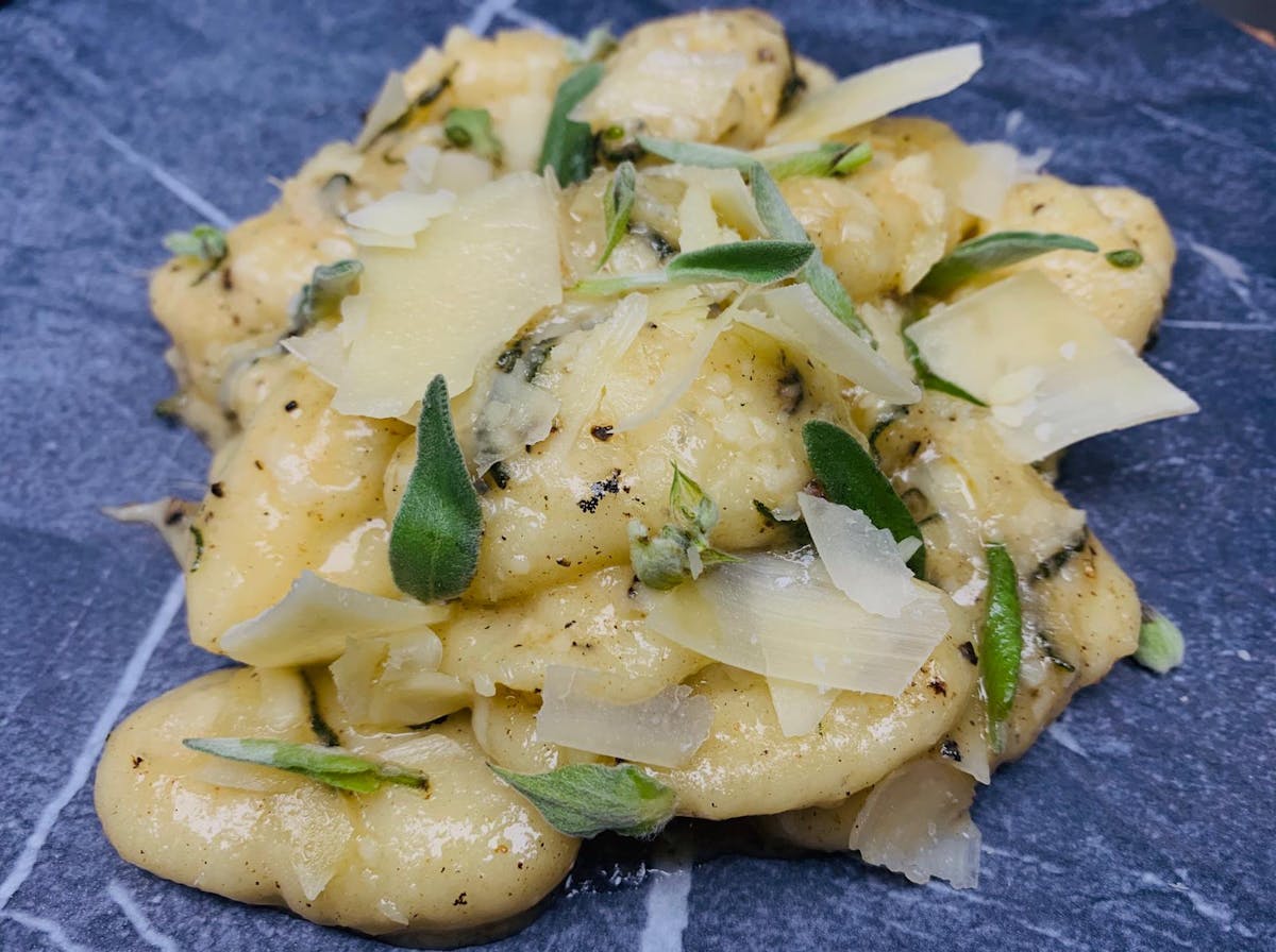 a close up of Chef Nino's Gnocchi with Sage Butter Sauce at Florie's in Palm Beach