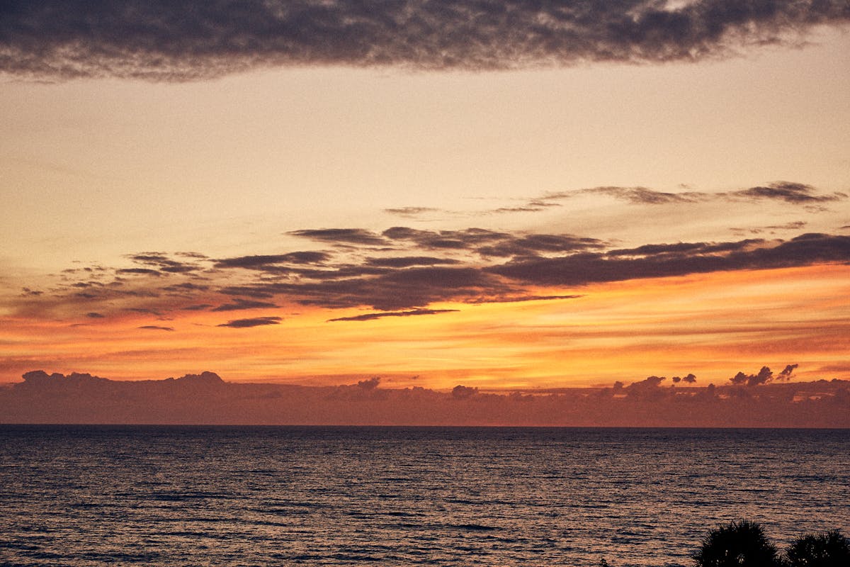 a sunset over a body of water