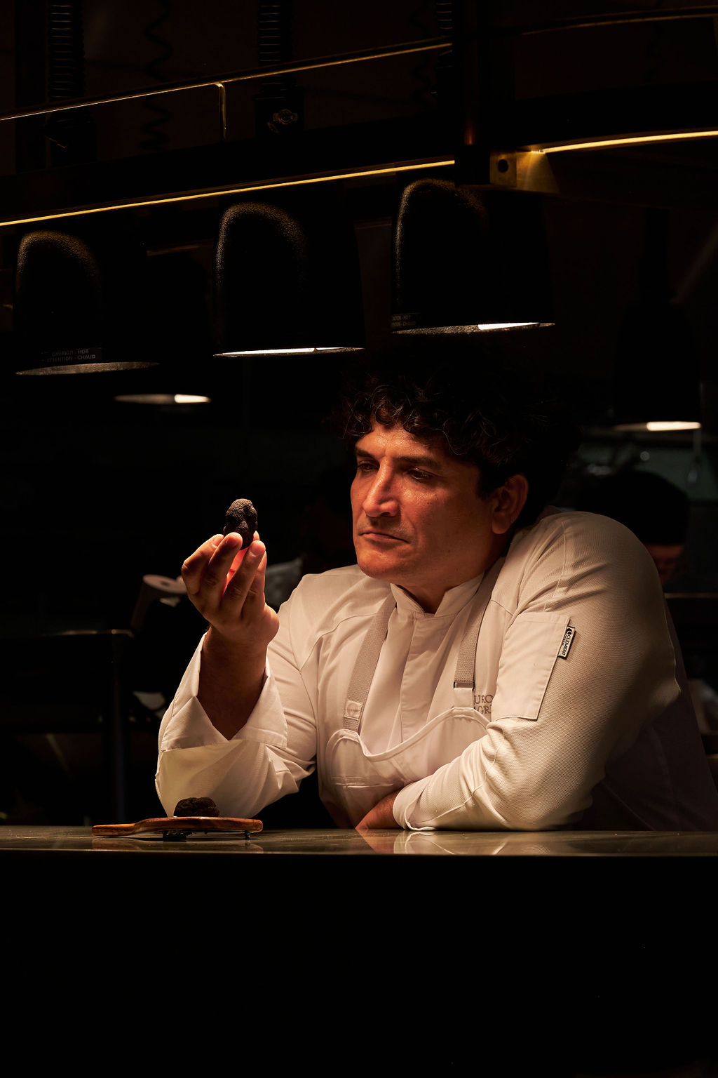 Mauro Colagreco sitting in front of a window