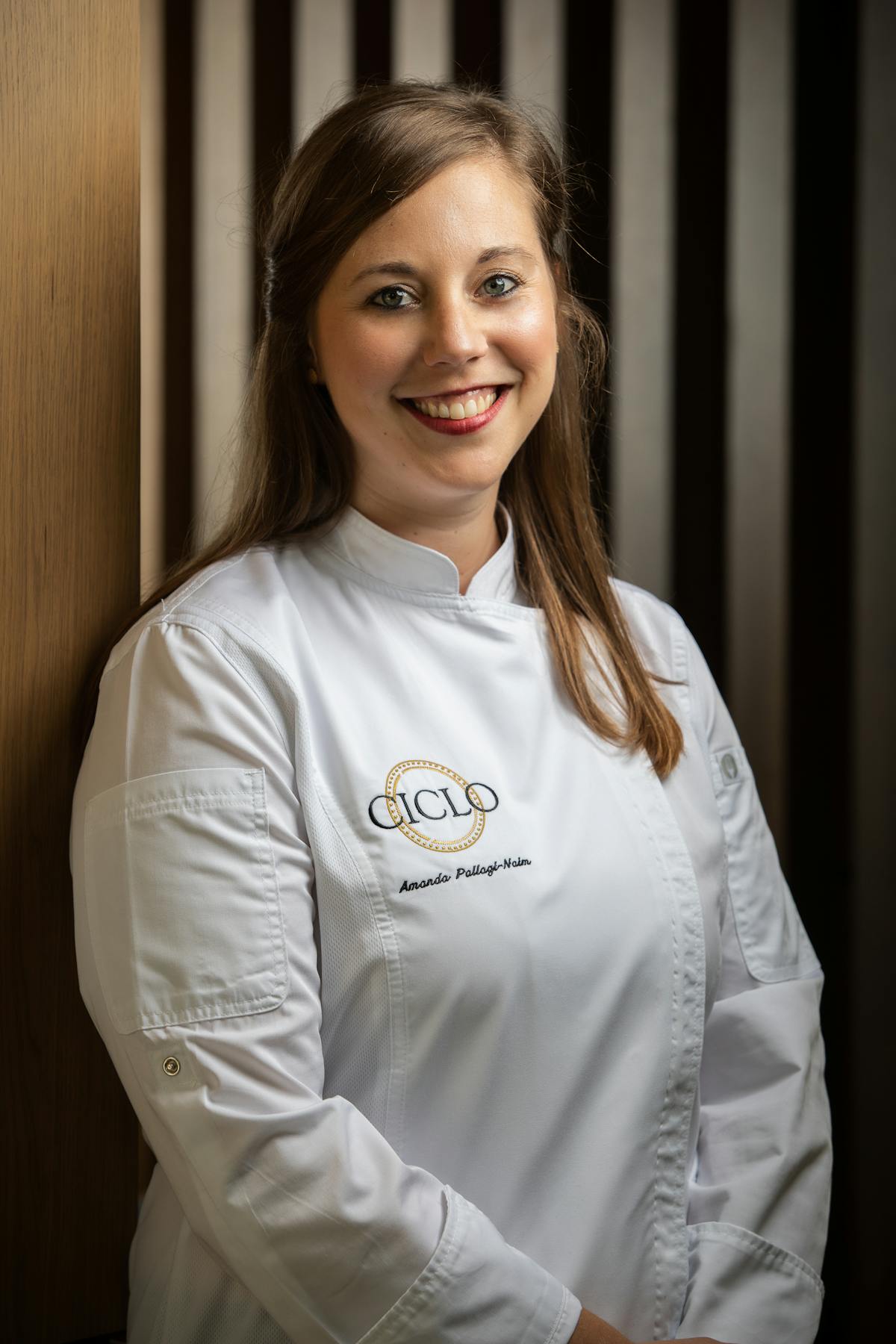 executive pastry chef Amanda Pallagi-Naim smiles at the camera