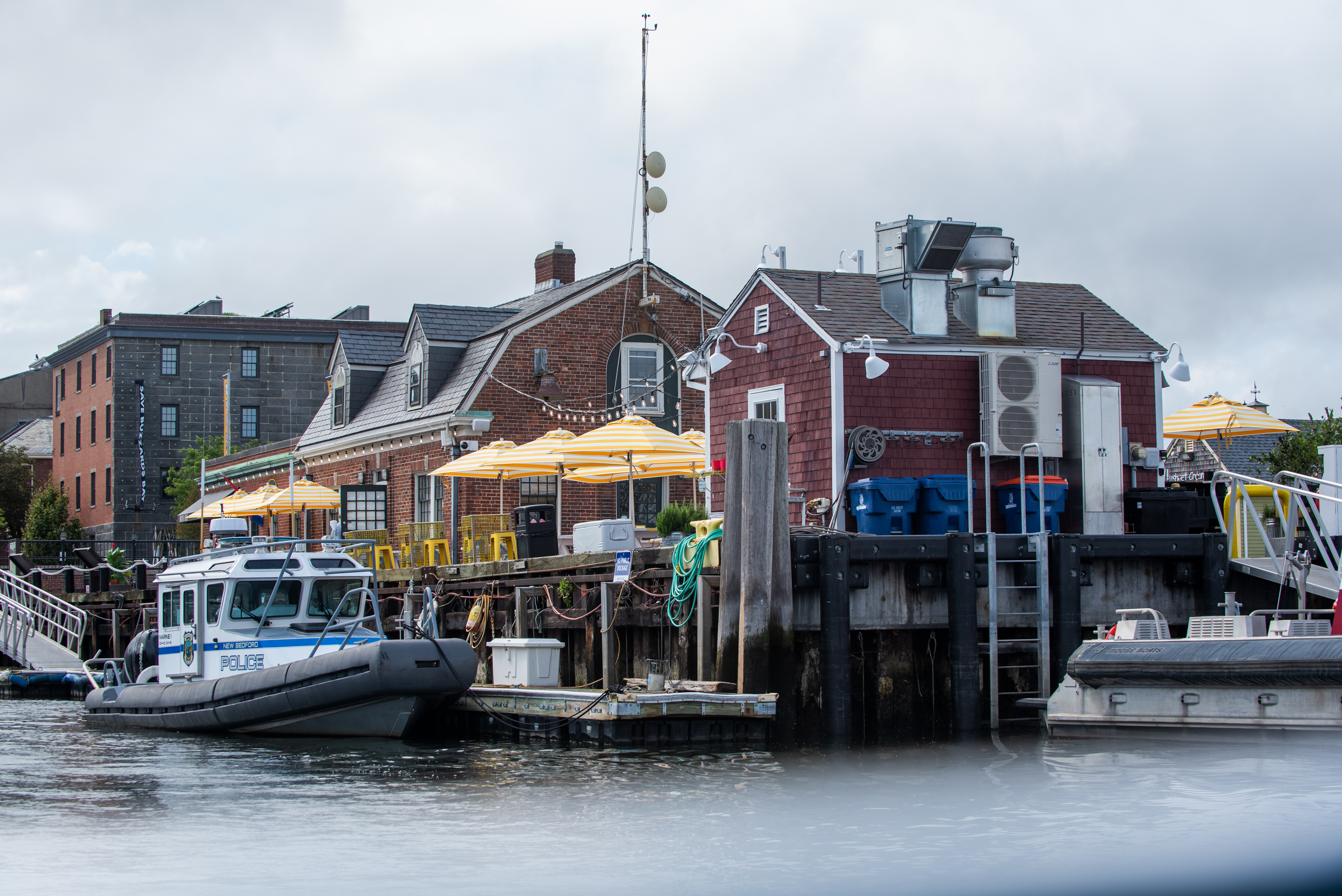 a boat is docked next to a body of water