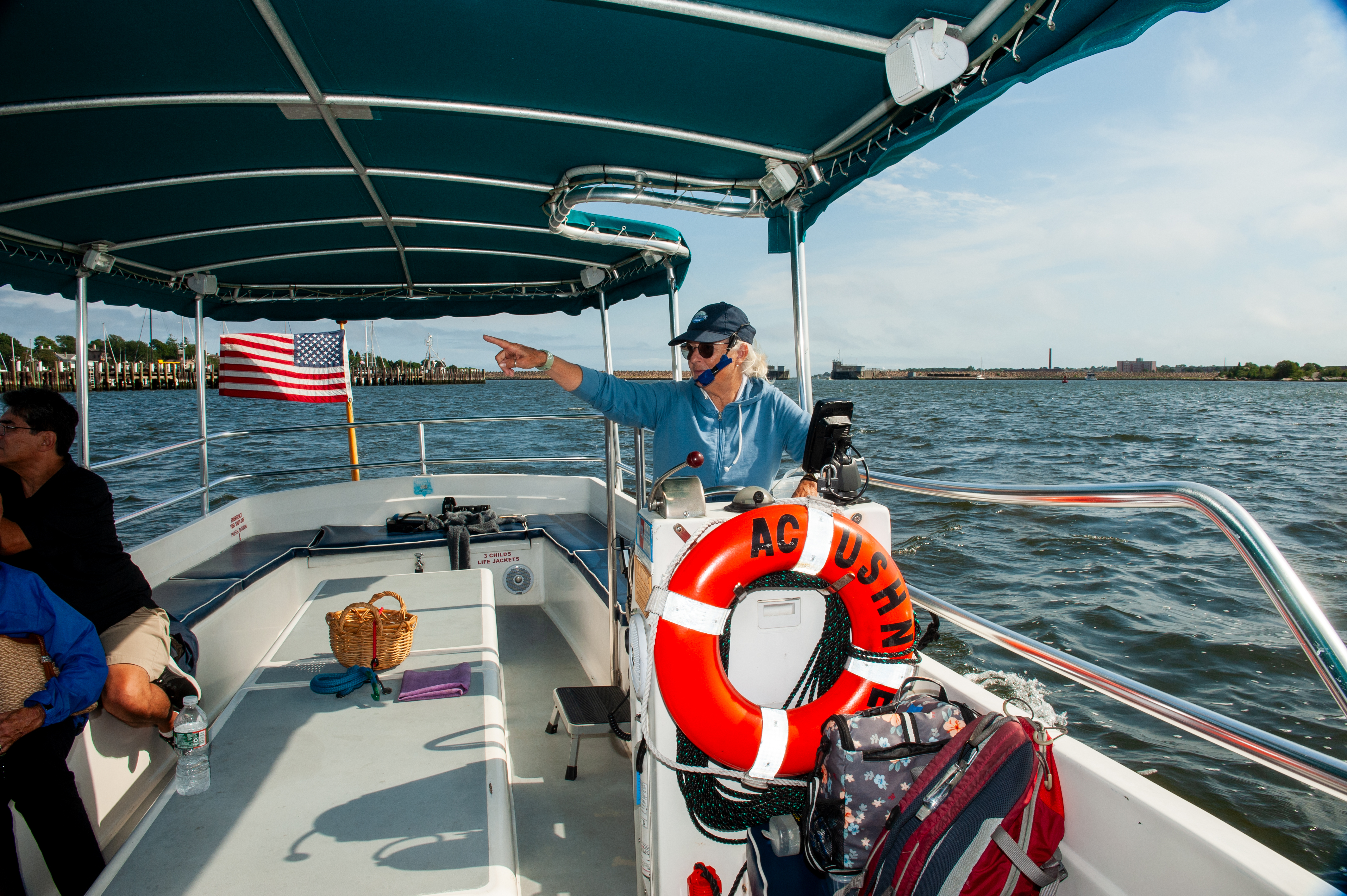 a group of people on a boat in the water