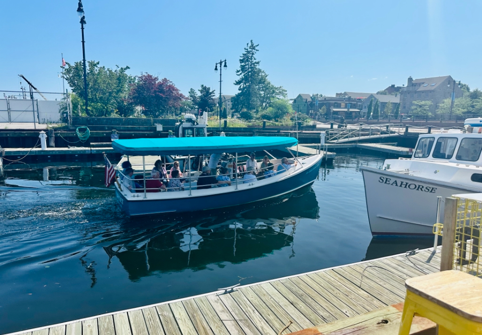 a boat is docked next to a body of water