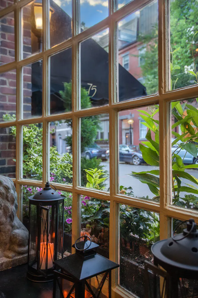 a window with a view of a street and a street