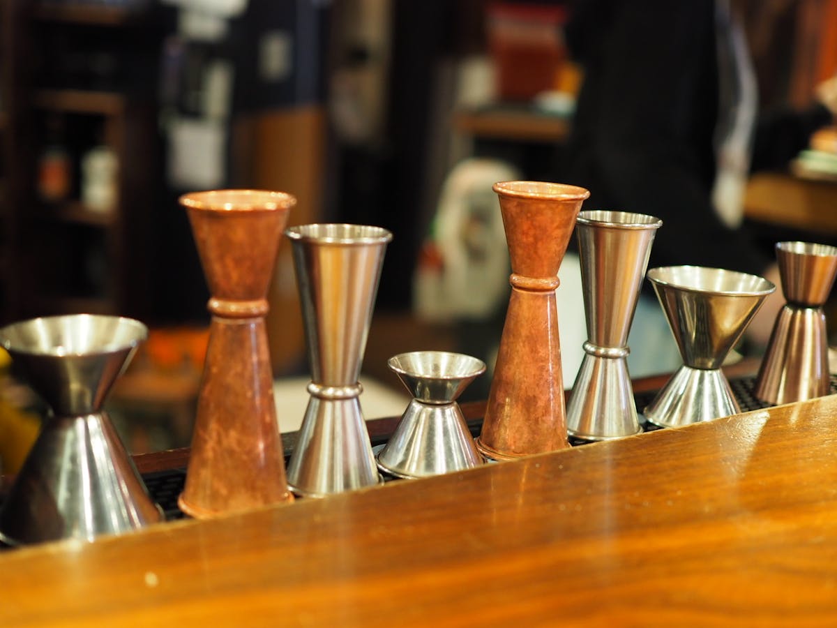 a vase sitting on top of a wooden table