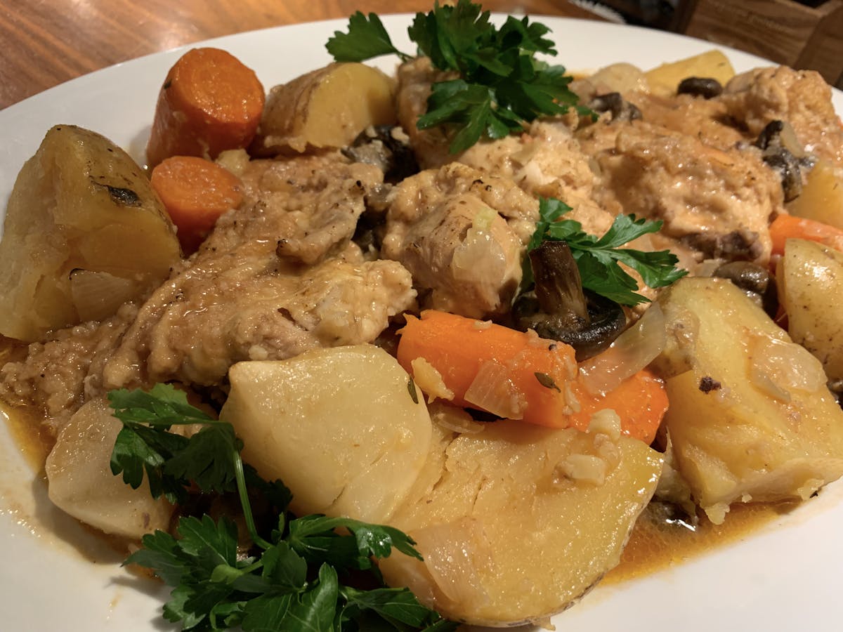 a plate of food with meat and vegetables