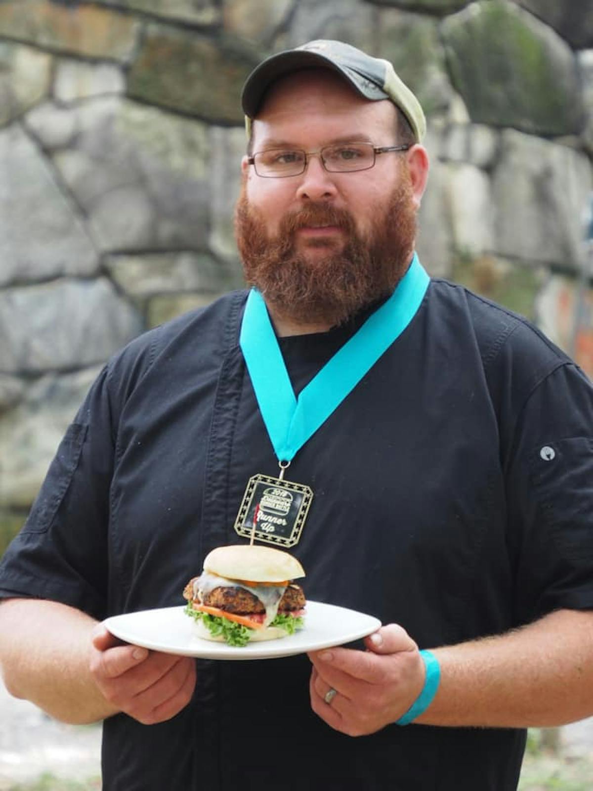a man holding a plate of food