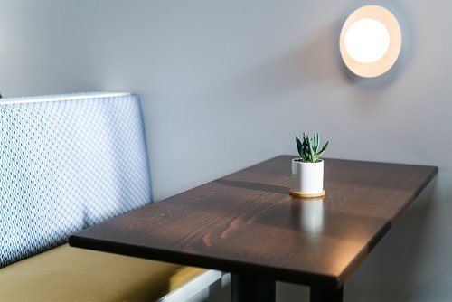 a lamp that is on top of a wooden table