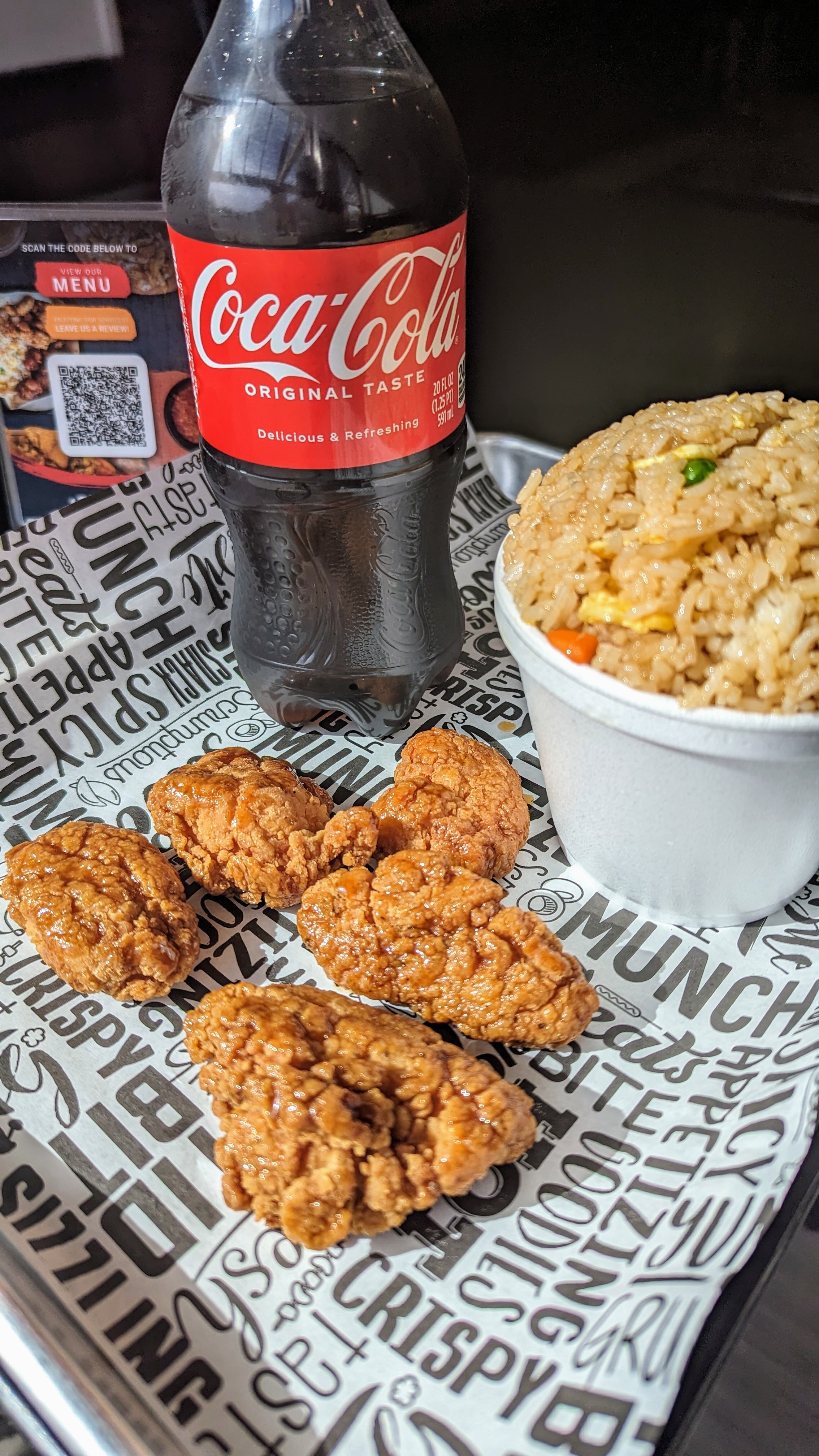 a plate of food and a bottle on a table
