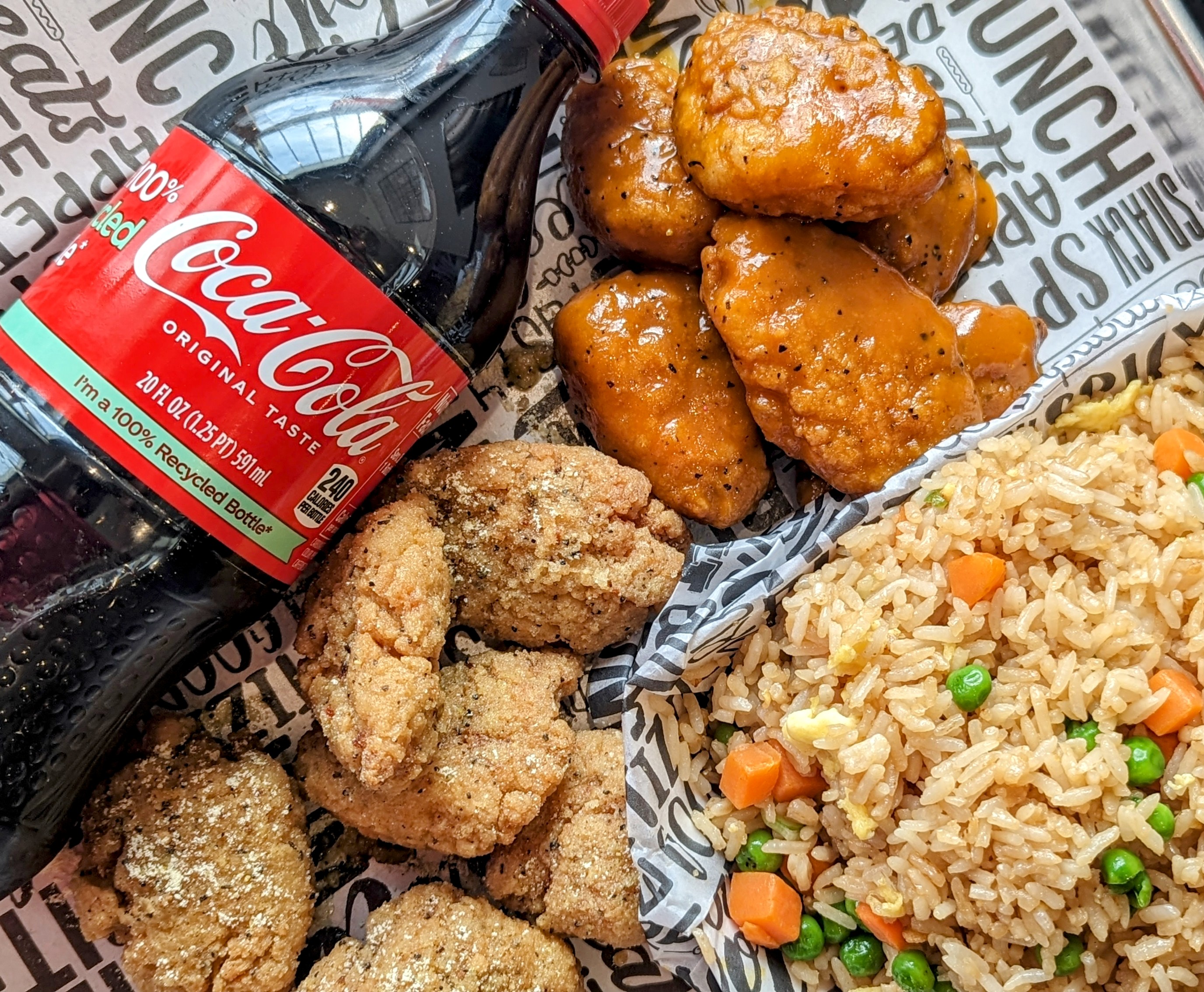 a plate of food with rice meat and vegetables