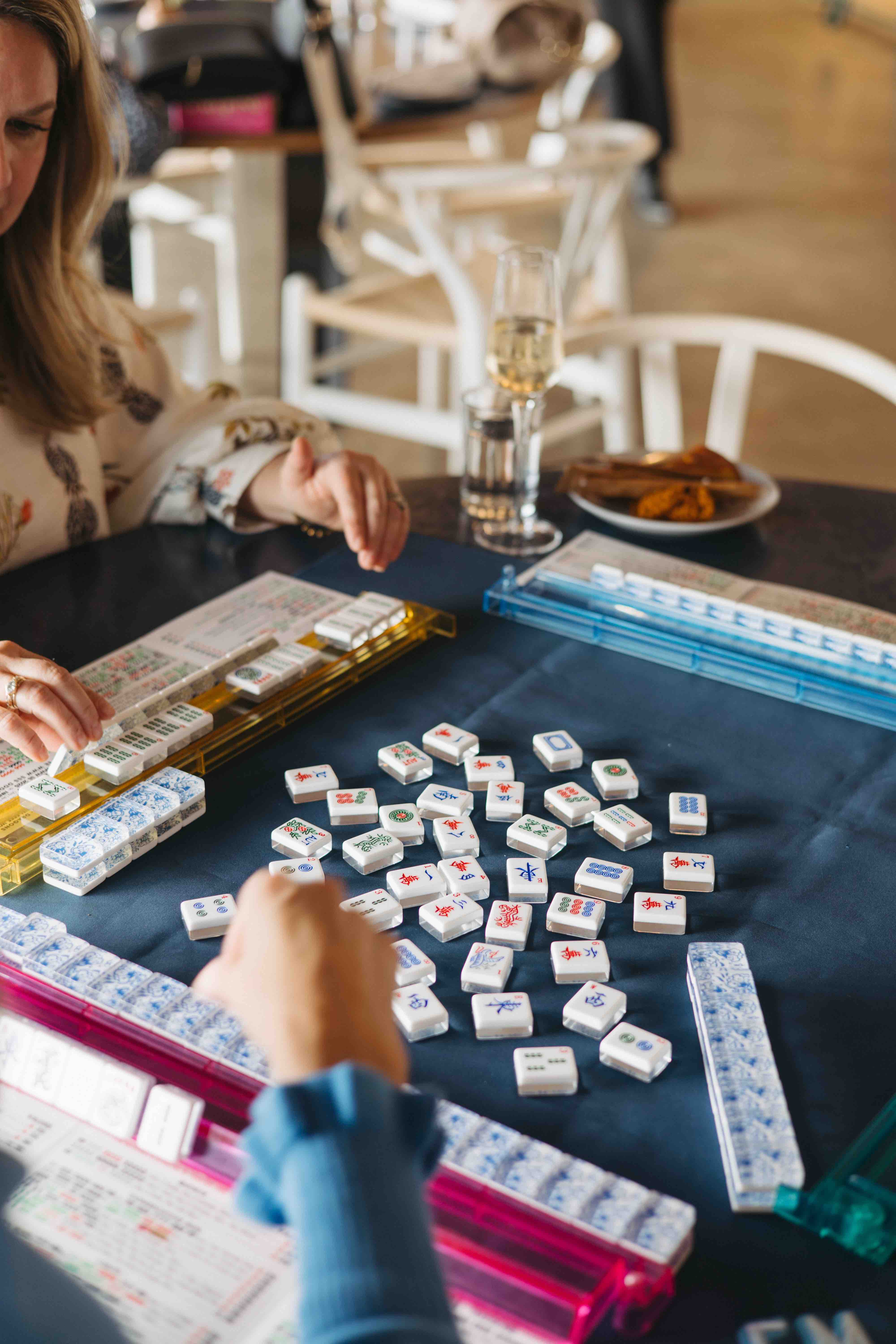 a woman sitting at a table eating food