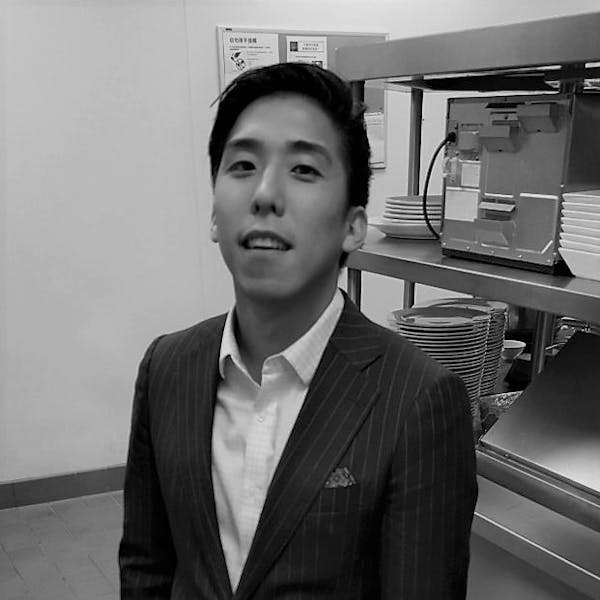 a man wearing a suit and tie