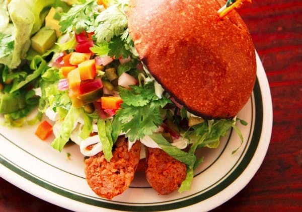 a burger with salad