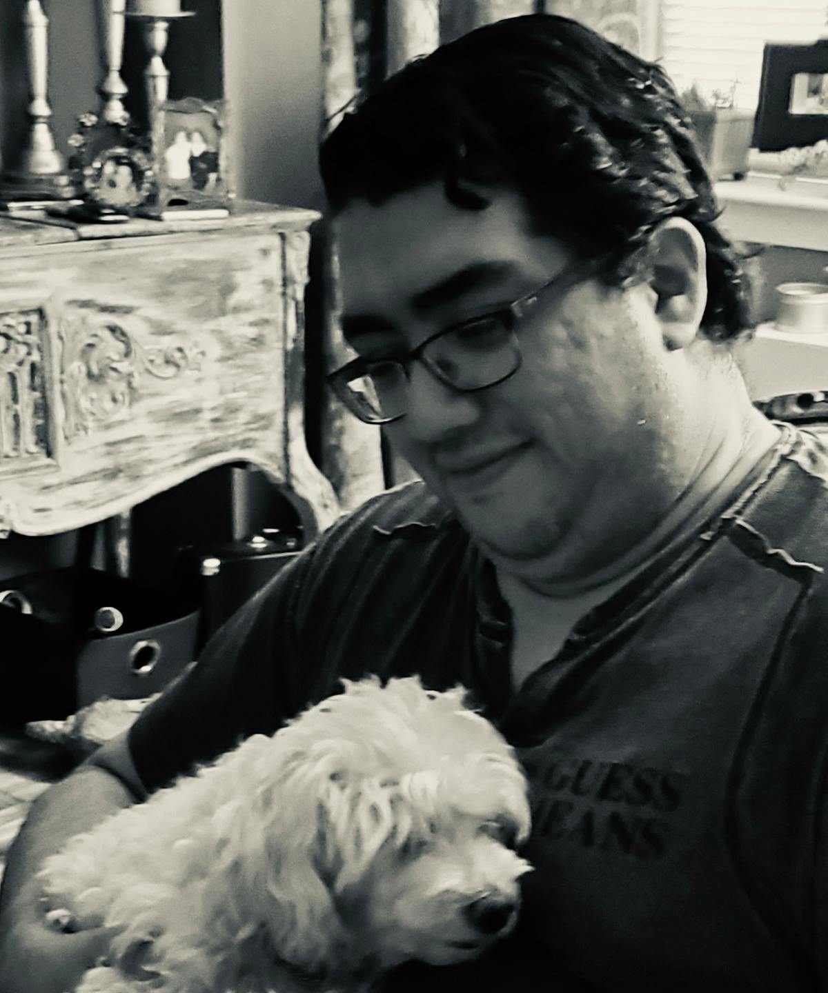 a man holding a dog