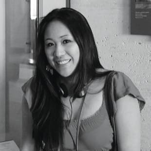 Kim Hom smiling at the camera