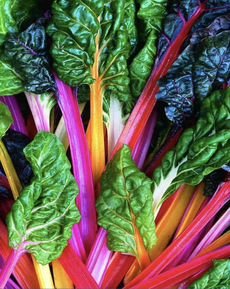 a box filled with different types of vegetables