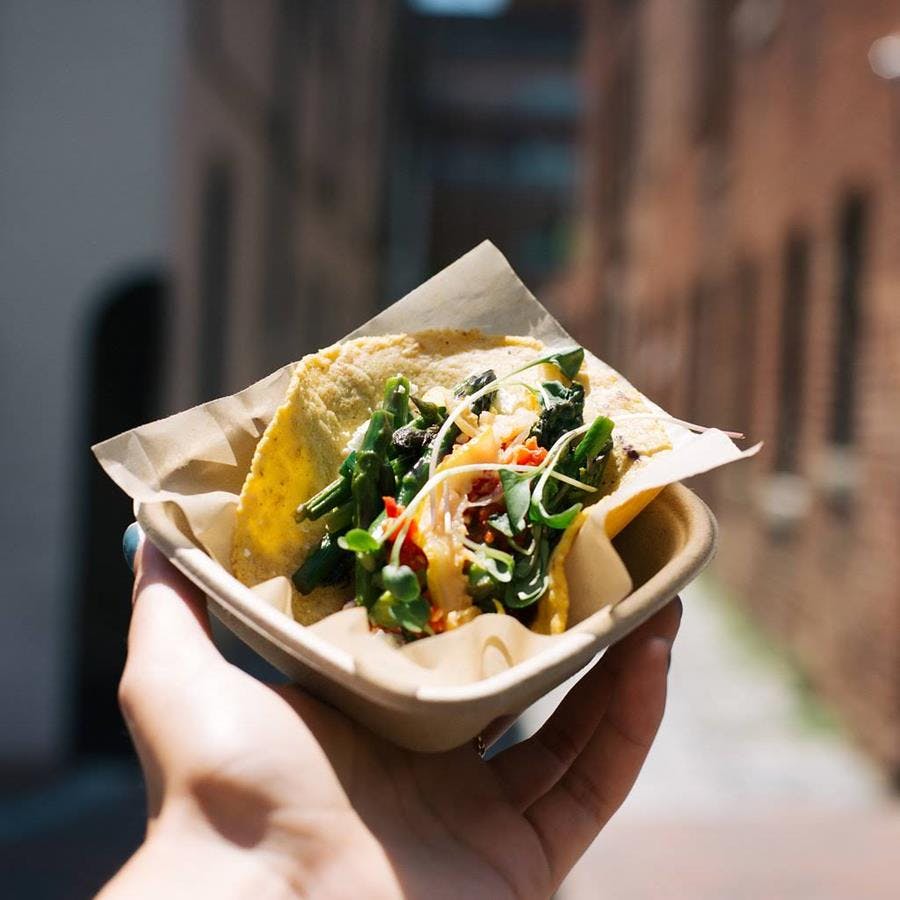 a woman holding a plate of food