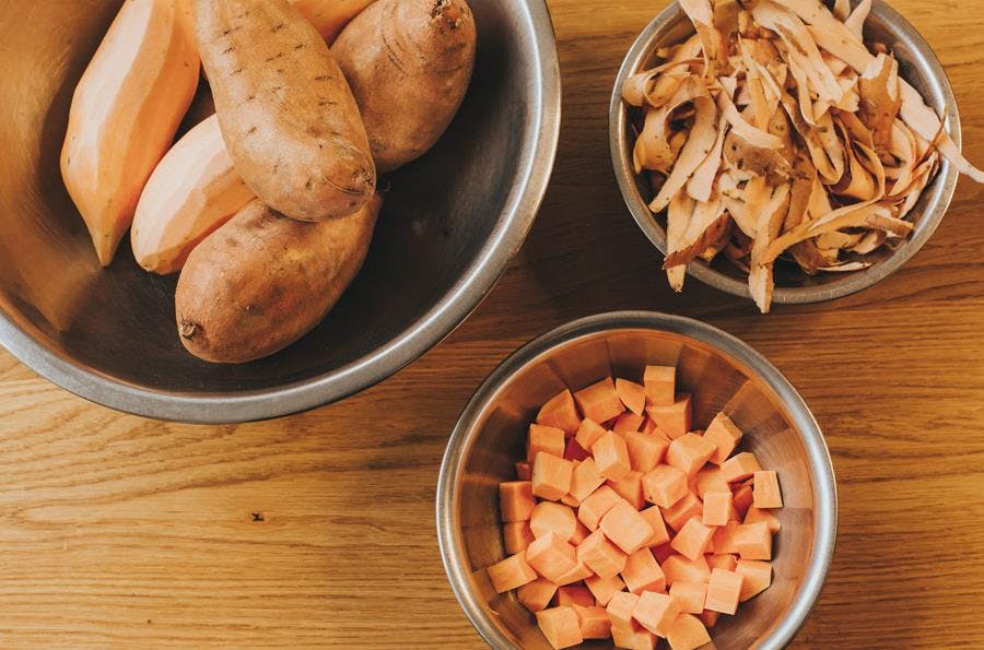 a bowl of food on a wooden table