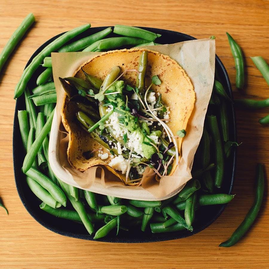 a sandwich sitting on top of a wooden table