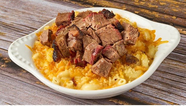 a plate of food sitting on top of a wooden table
