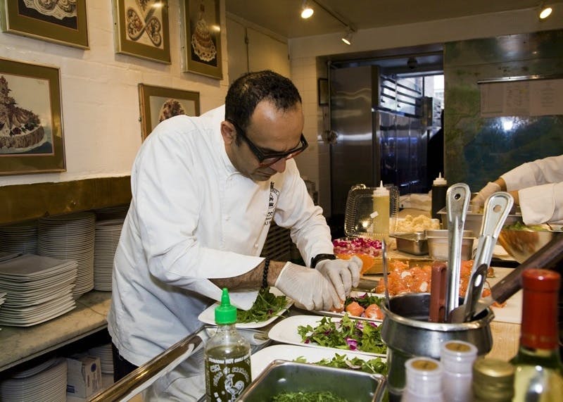 a person sitting at a table with food