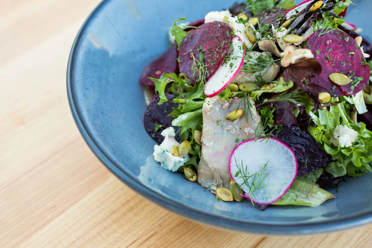 a bowl of salad on a plate
