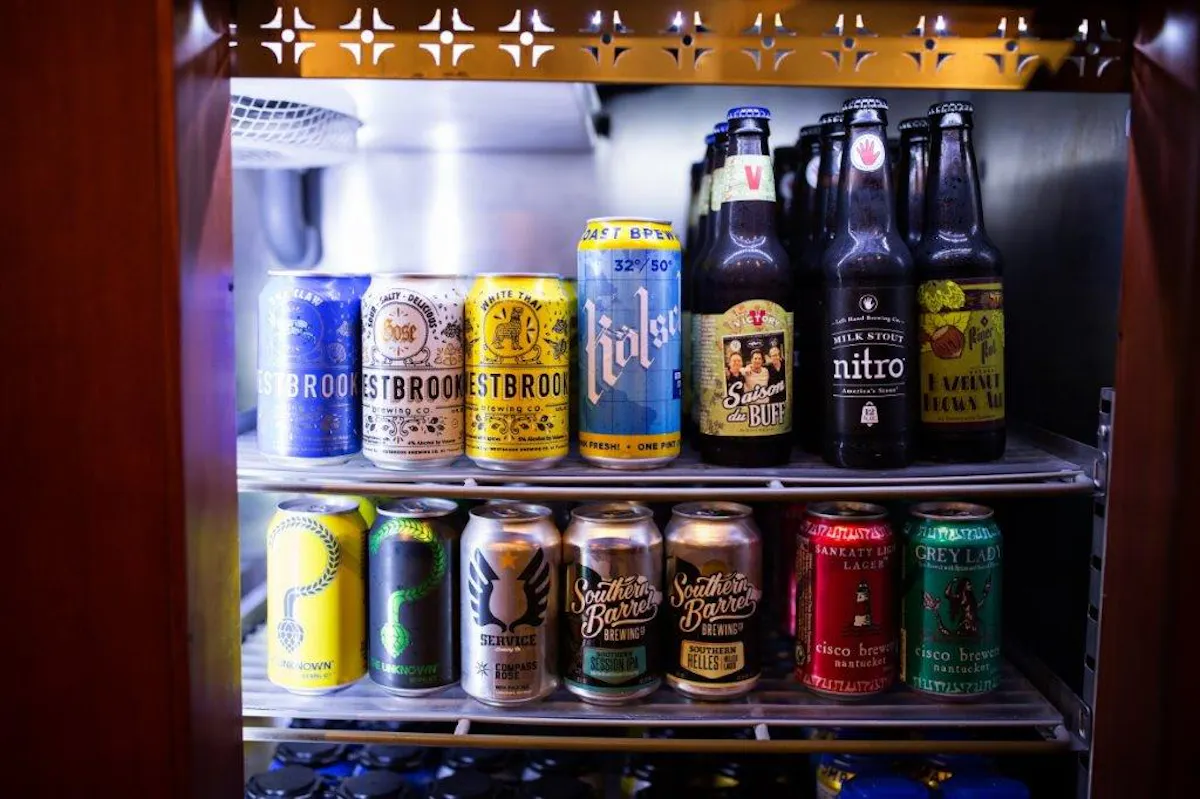a can next to a refrigerator