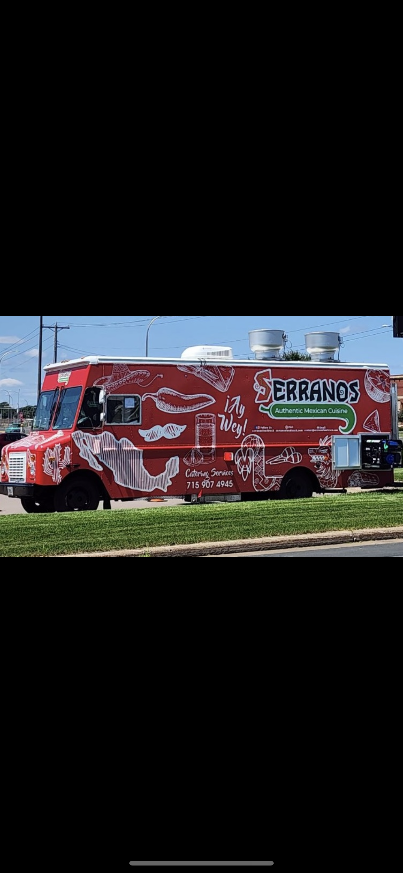 a truck that is sitting in the grass