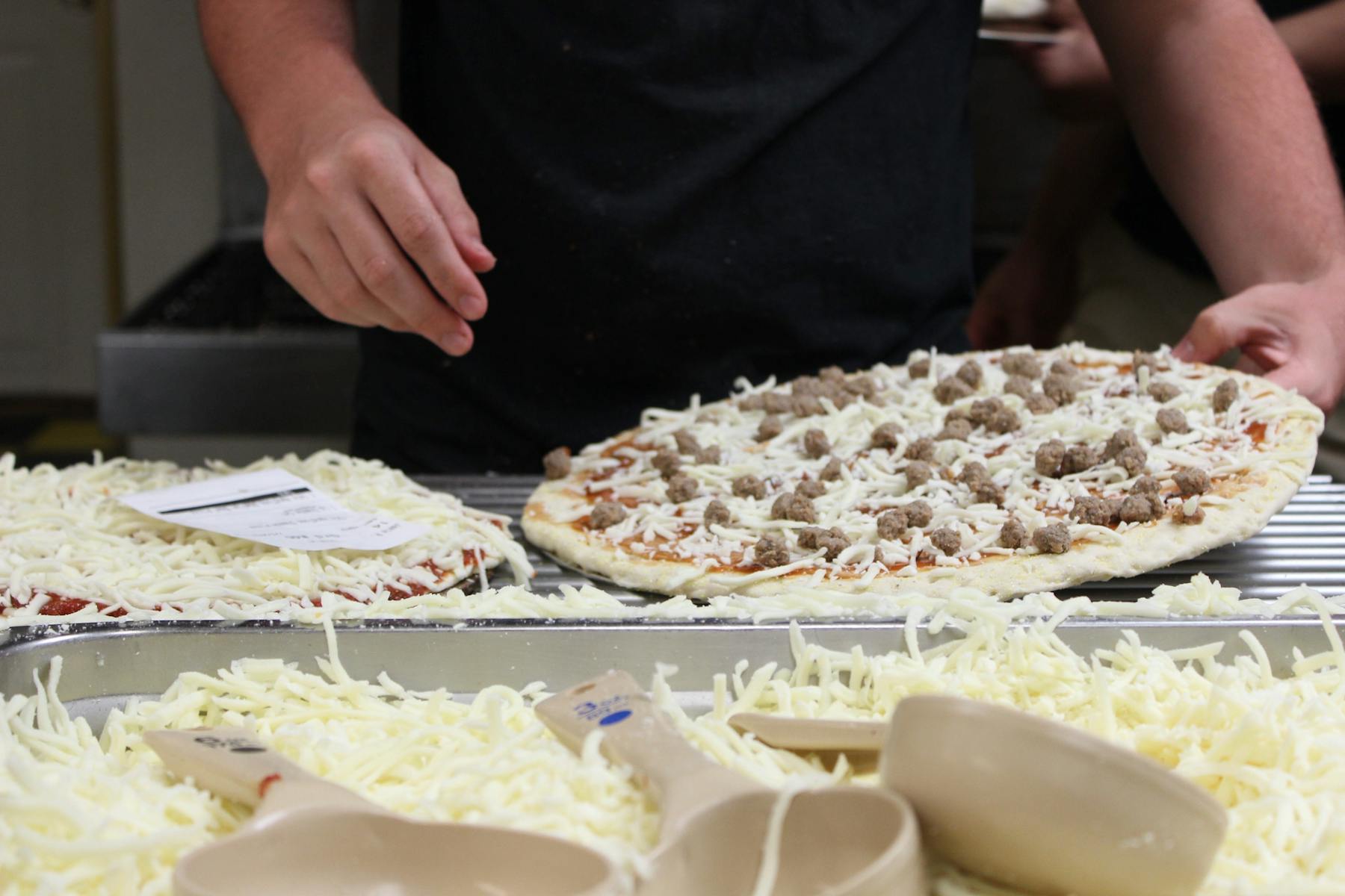 a person making a pizza