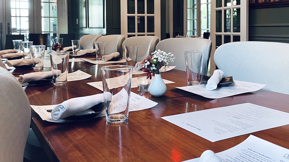 Dining room table with chairs and plates