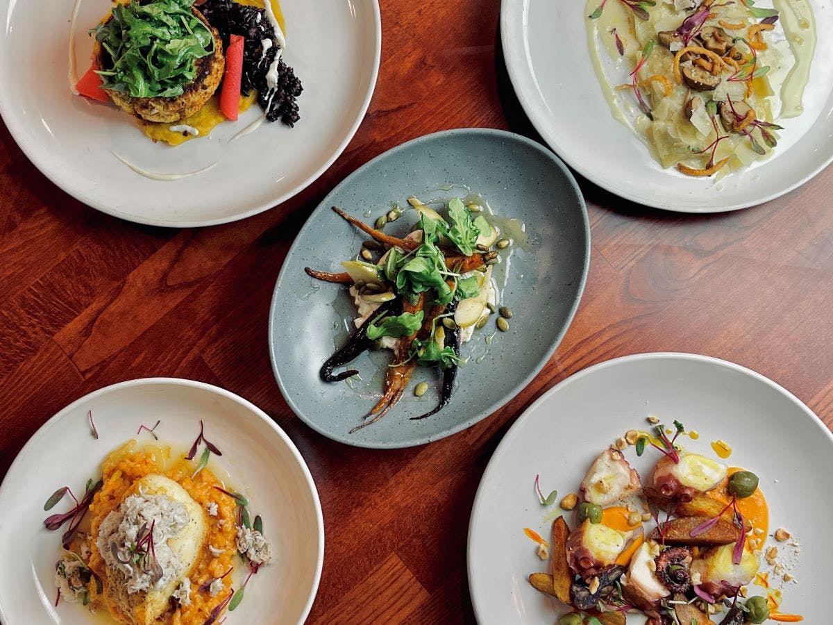 a bowl of food on a plate on a table