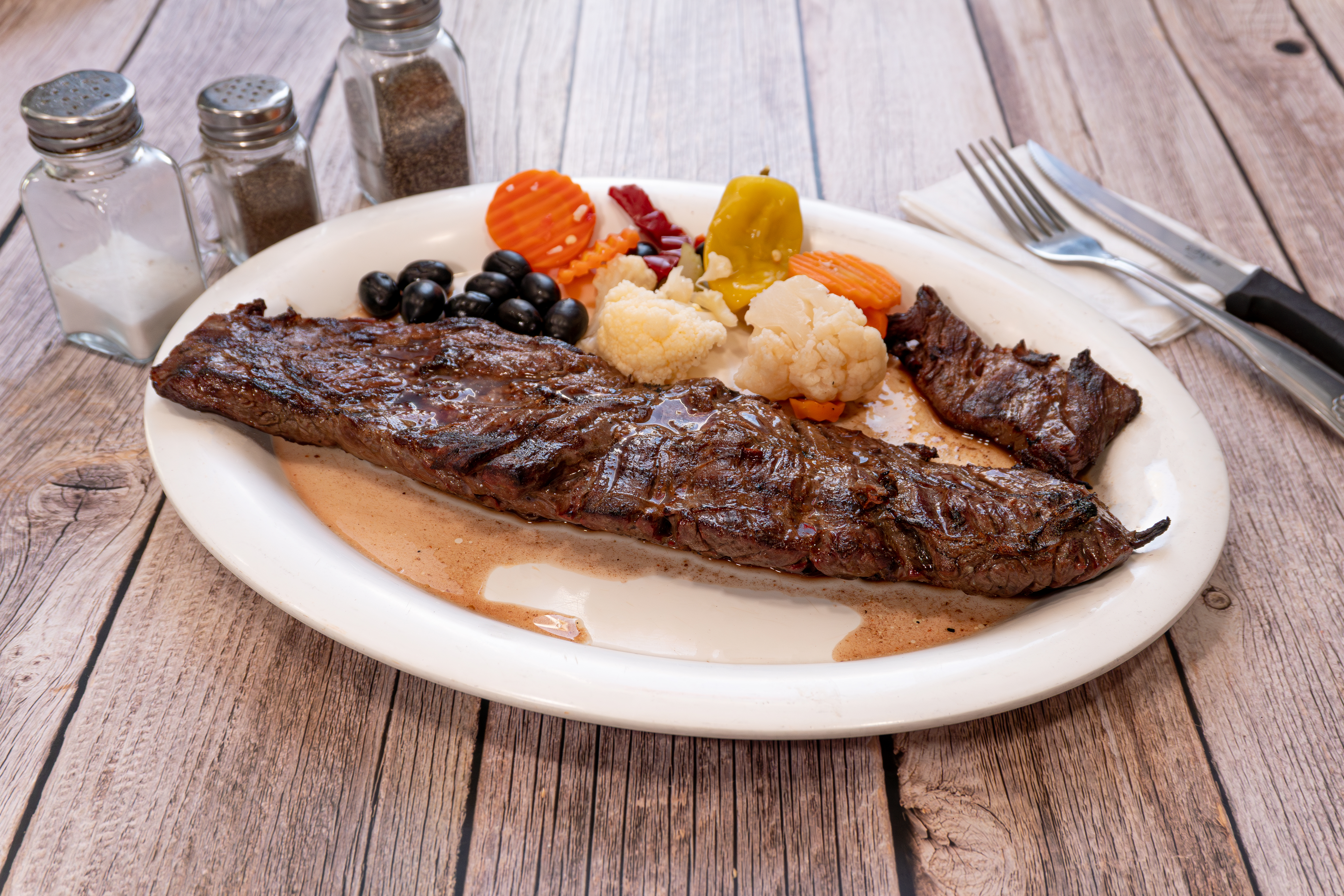 a plate of meat and vegetables