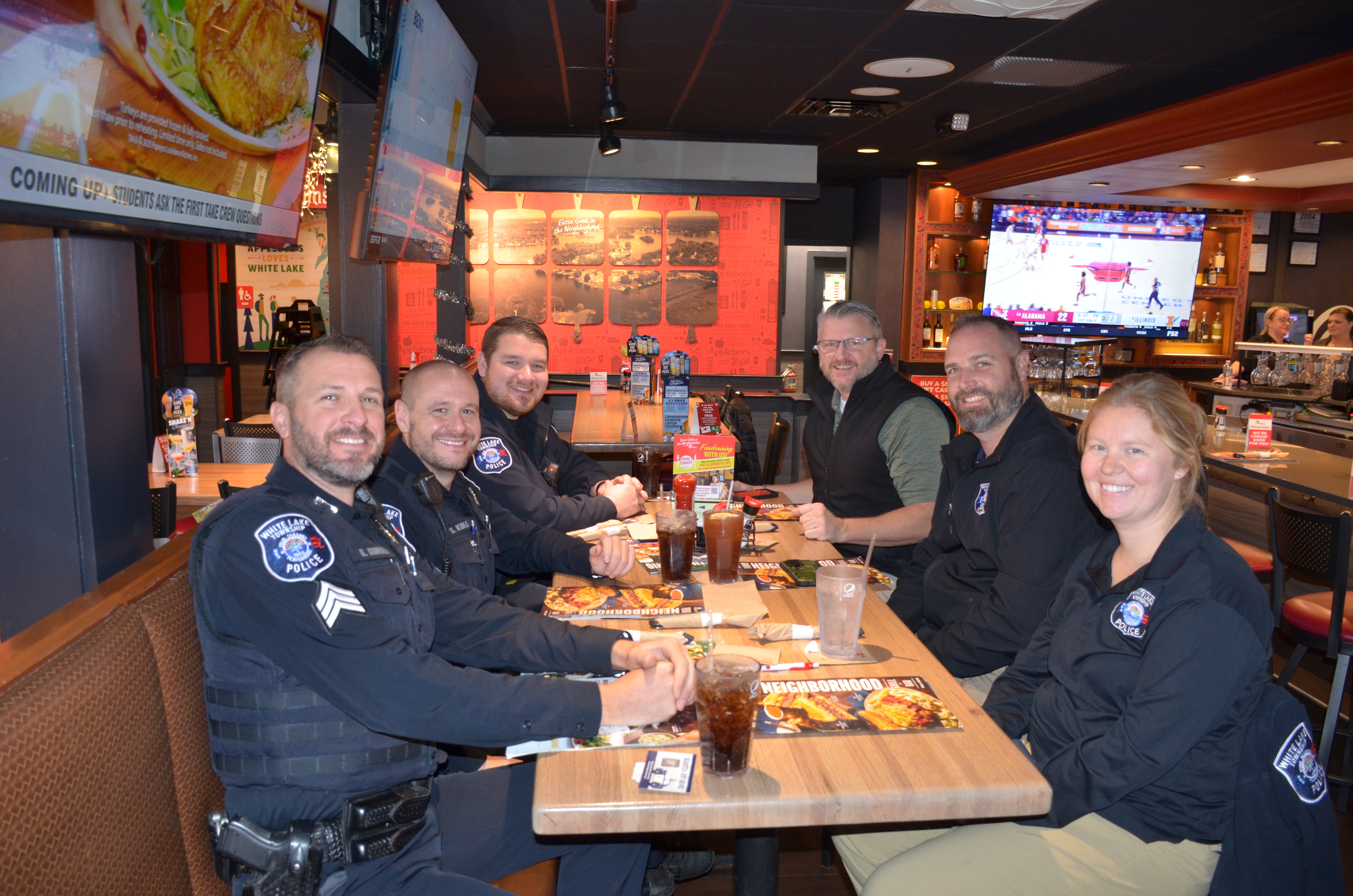 a group of people sitting at a table