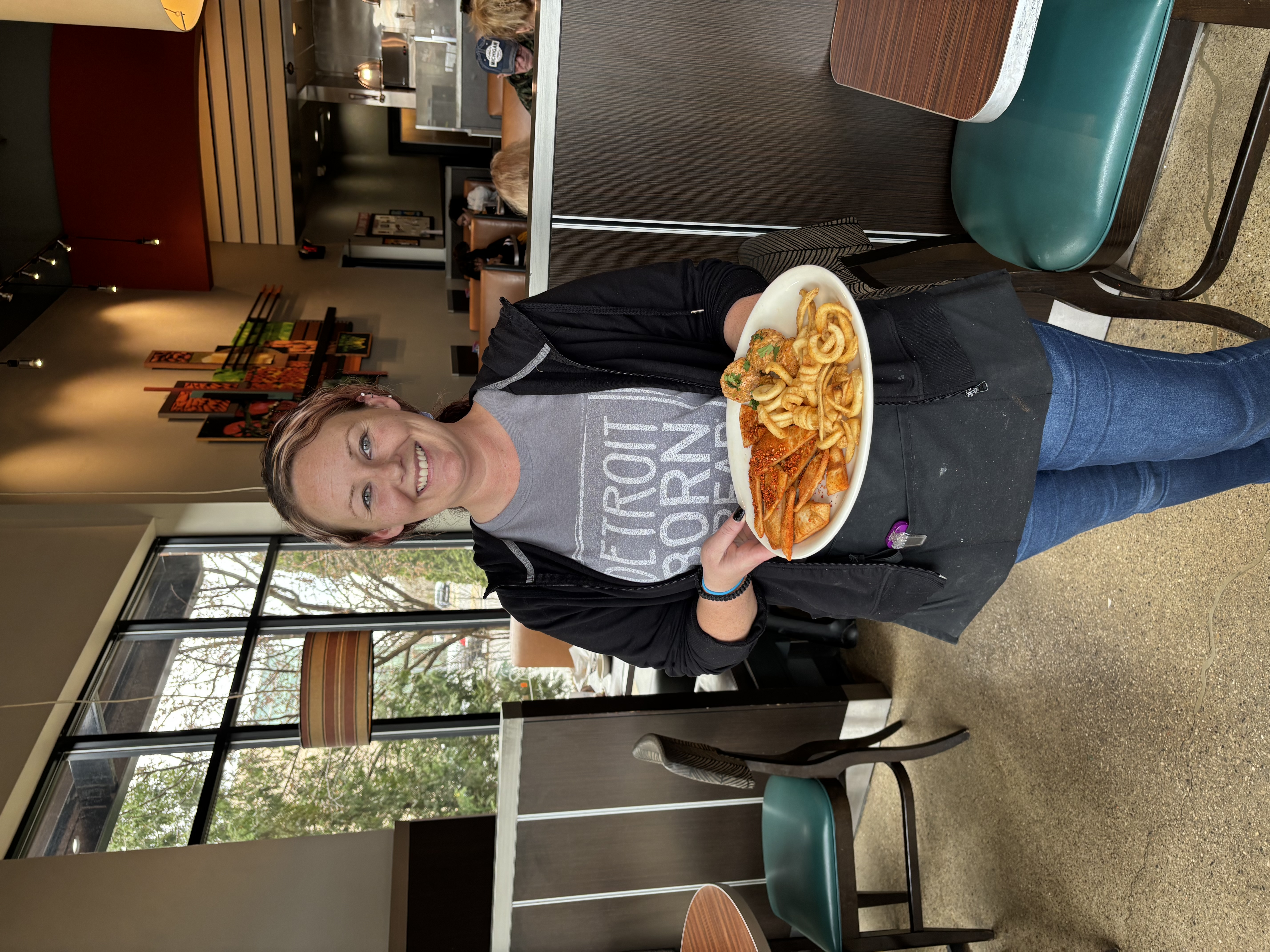a woman holding a plate of food