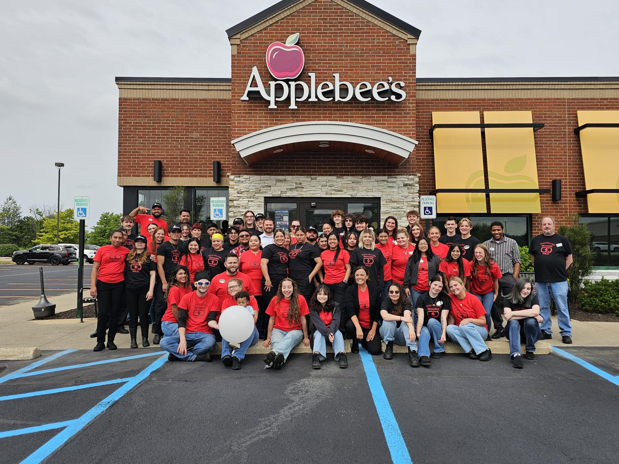 a group of people standing in front of a building