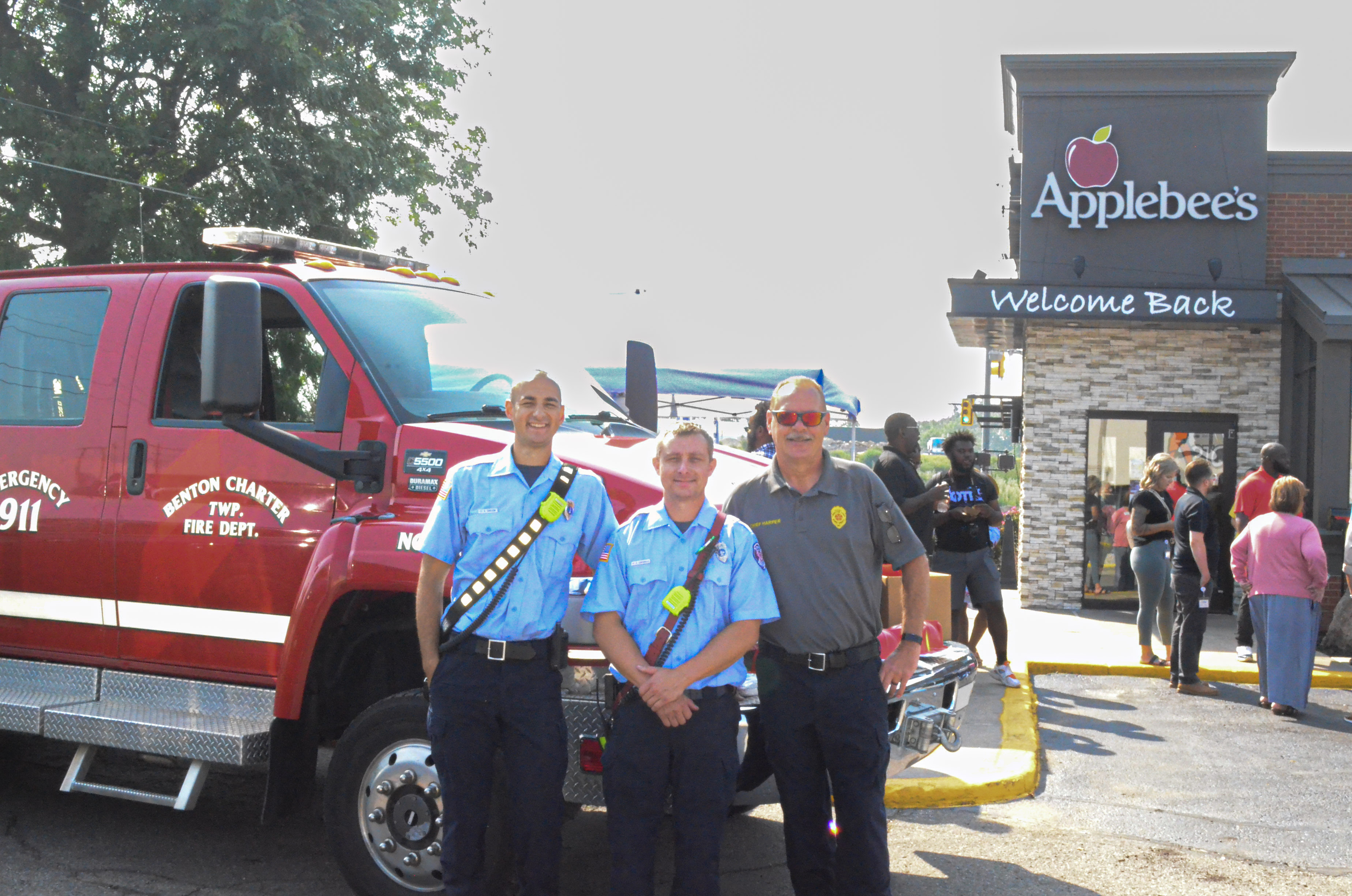 three men posing for the camera