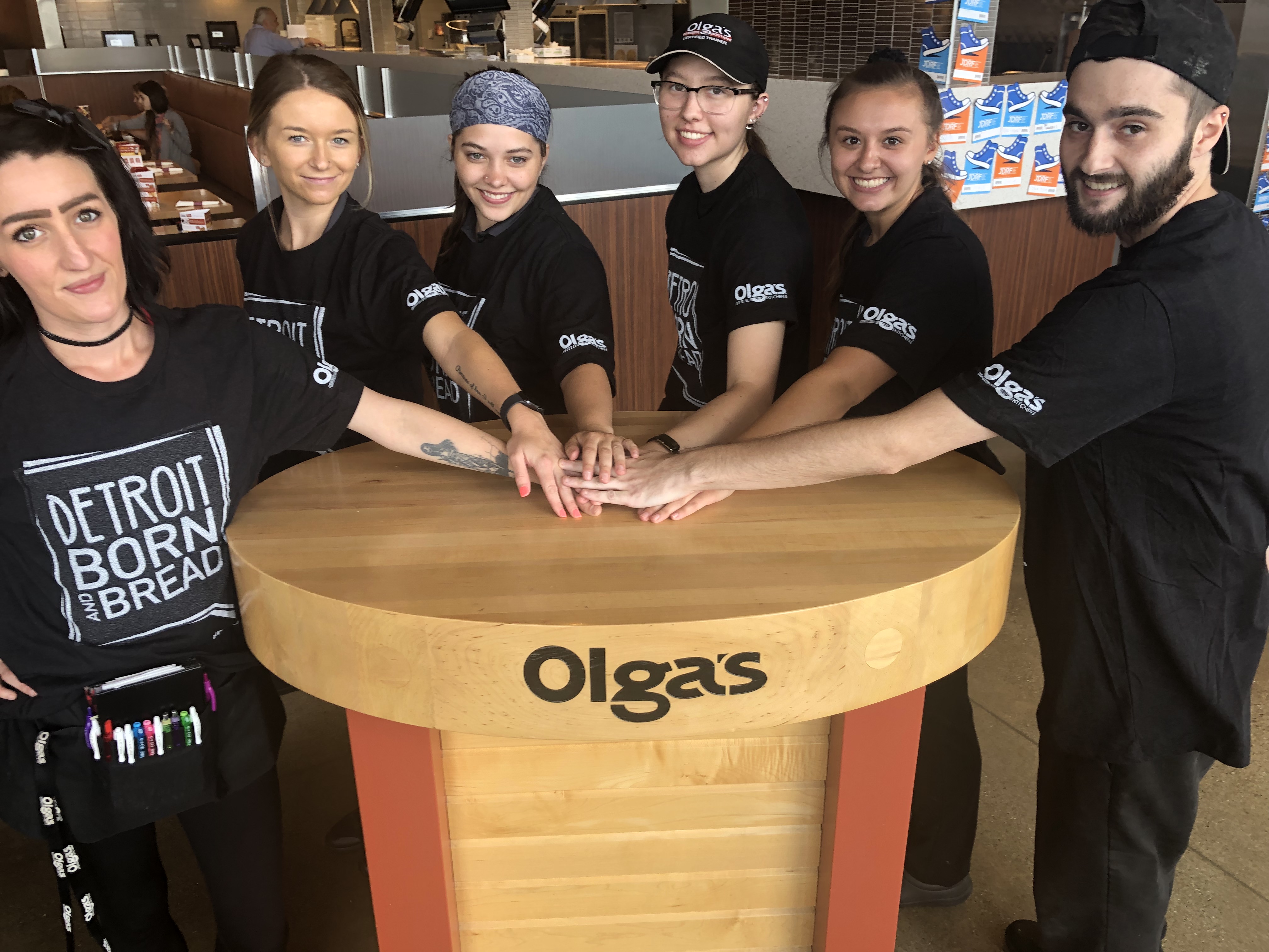 a group of women posing for the camera