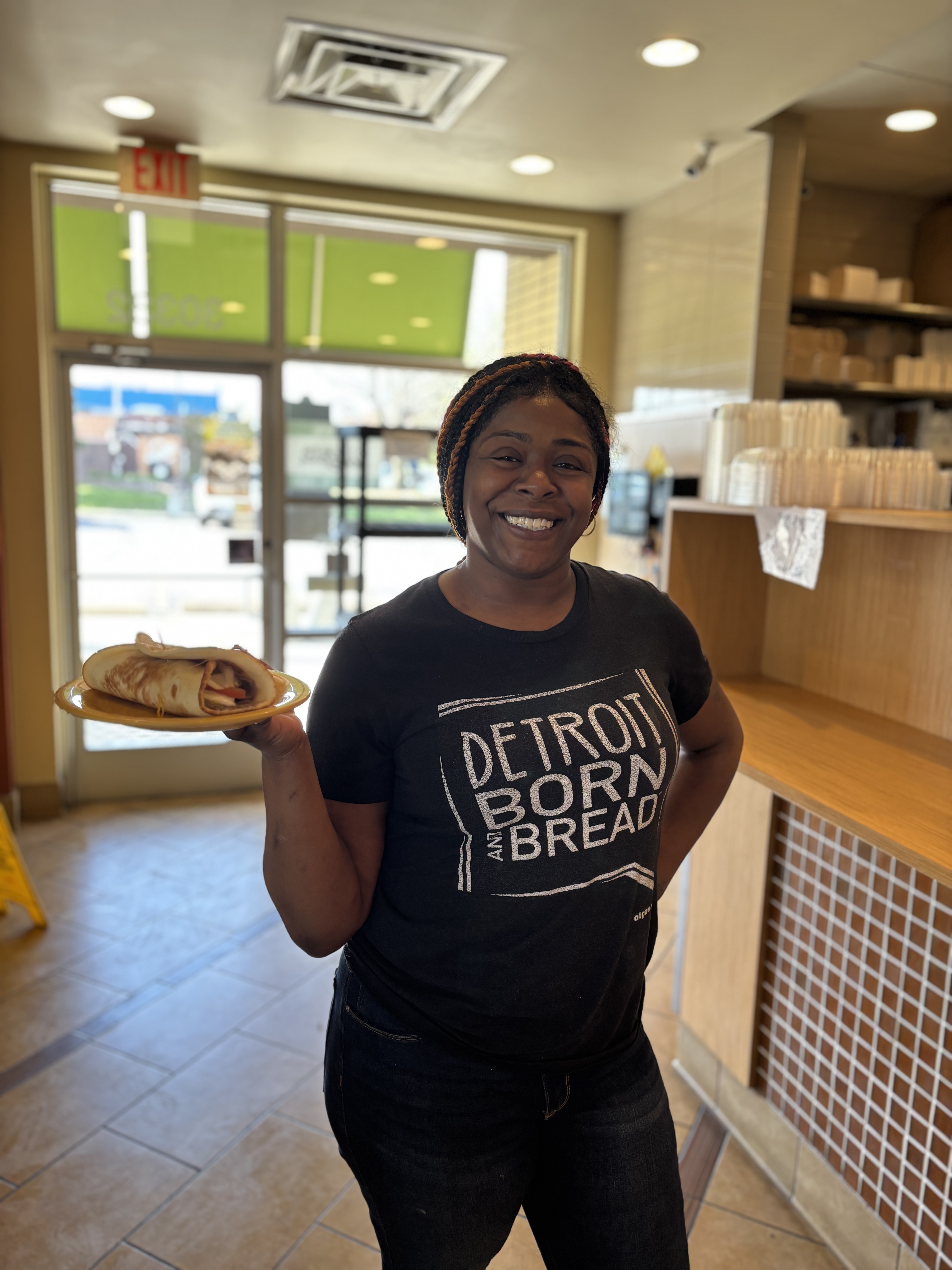 a woman holding a plate of food