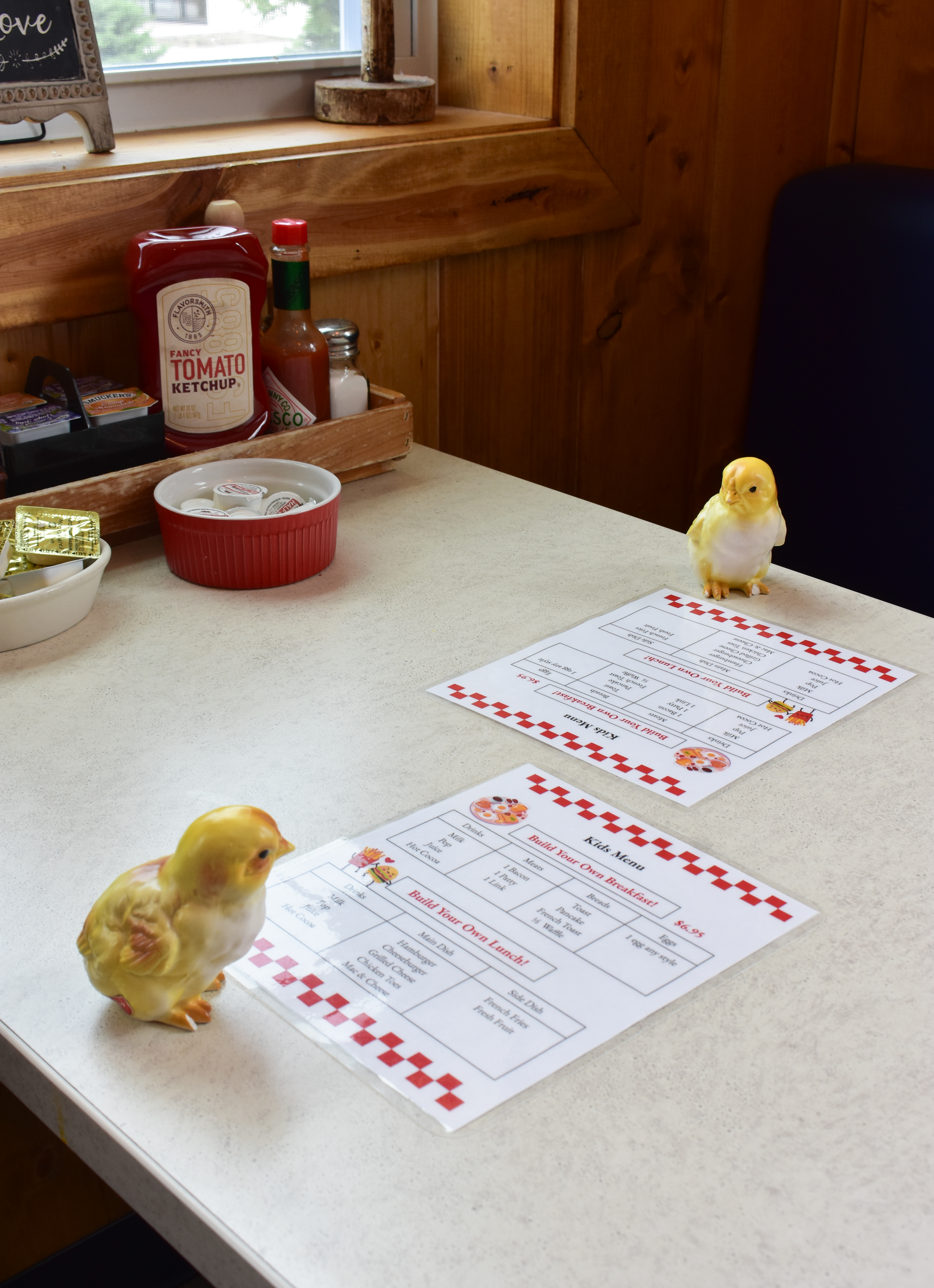a bird sitting on top of a table