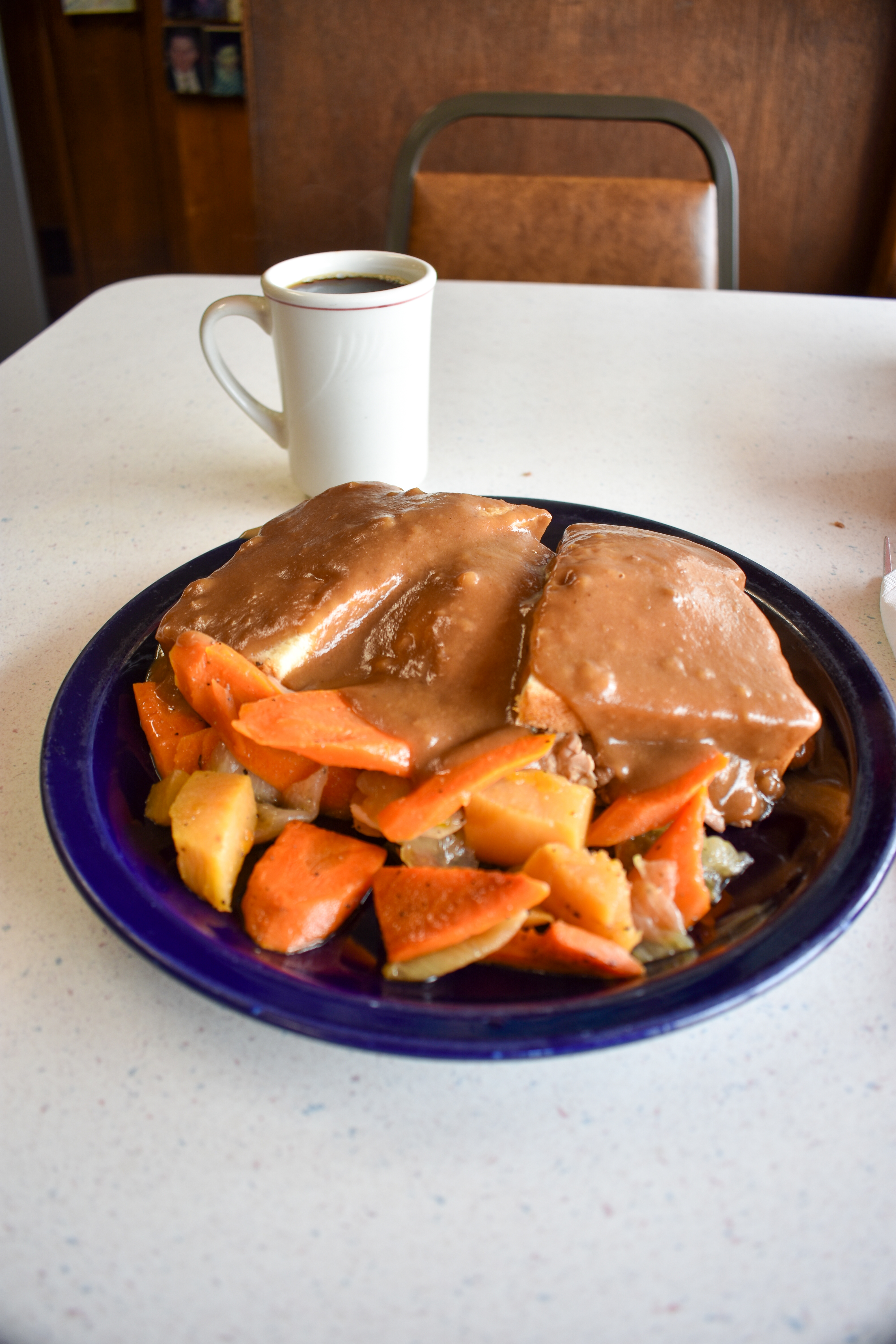 a plate of food and a cup of coffee