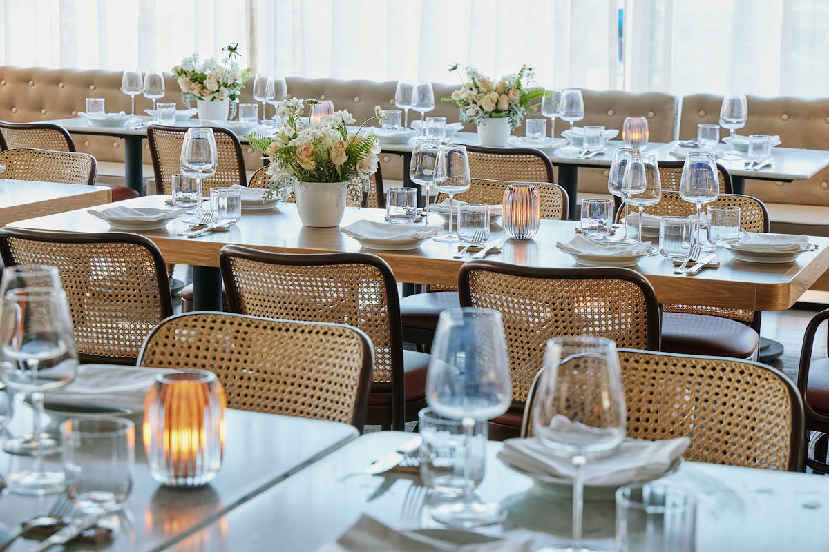 a dining table filled with wine glasses