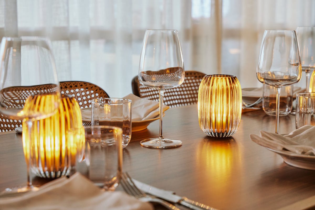 a dining table filled with wine glasses