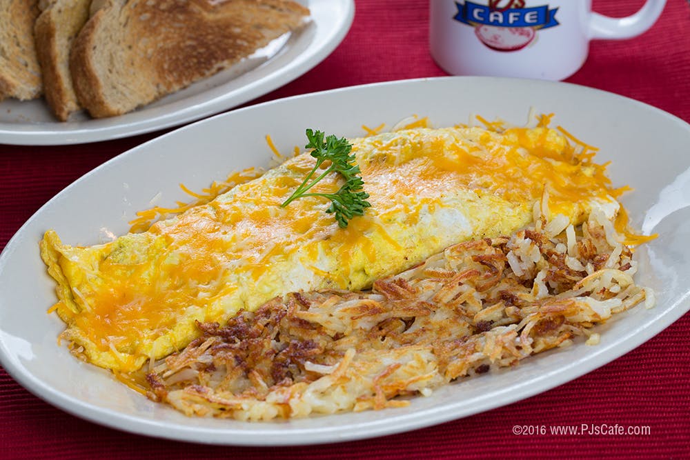 an omelet sitting on a white plate