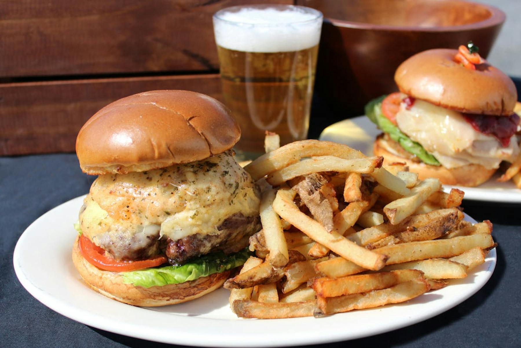 a plate with a sandwich and fries on a table