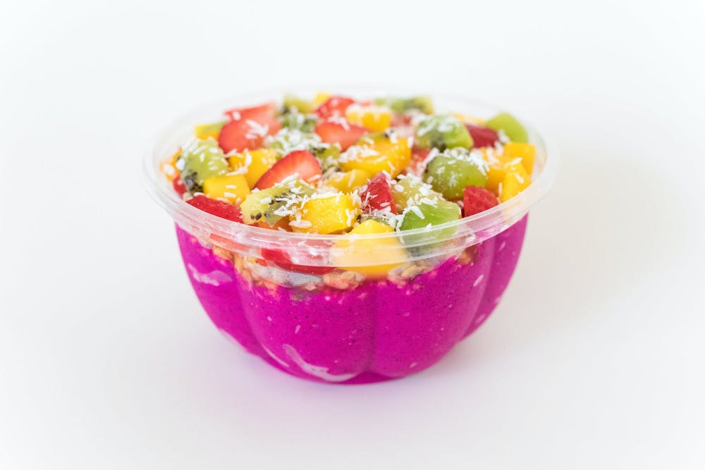 a bowl of fruit salad on a plate