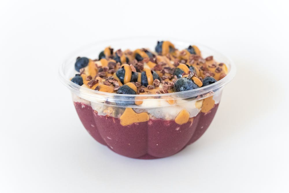 a bowl of fruit salad on a plate